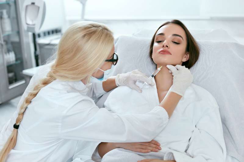 woman receiving belkyra chin injection