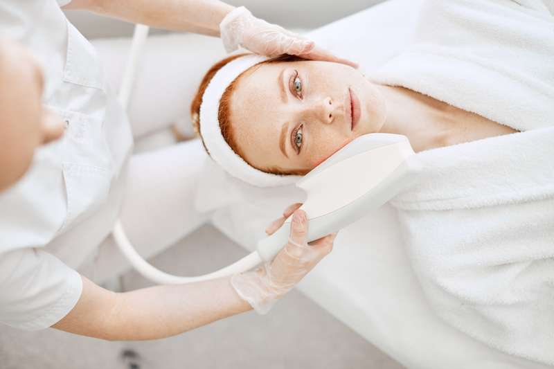 woman receiving dermaglow laser skin peel treatment